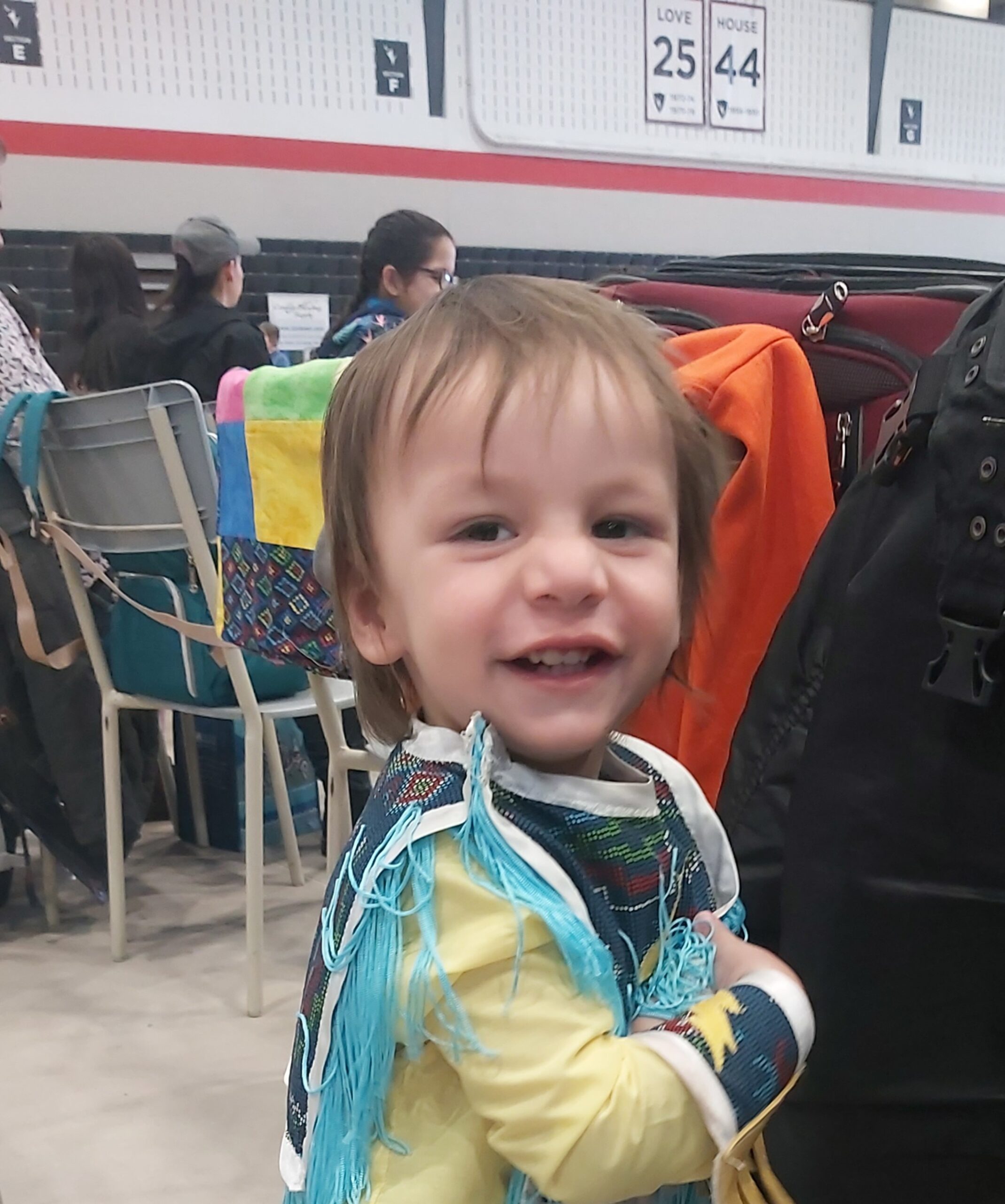 Little boy smiling in regalia