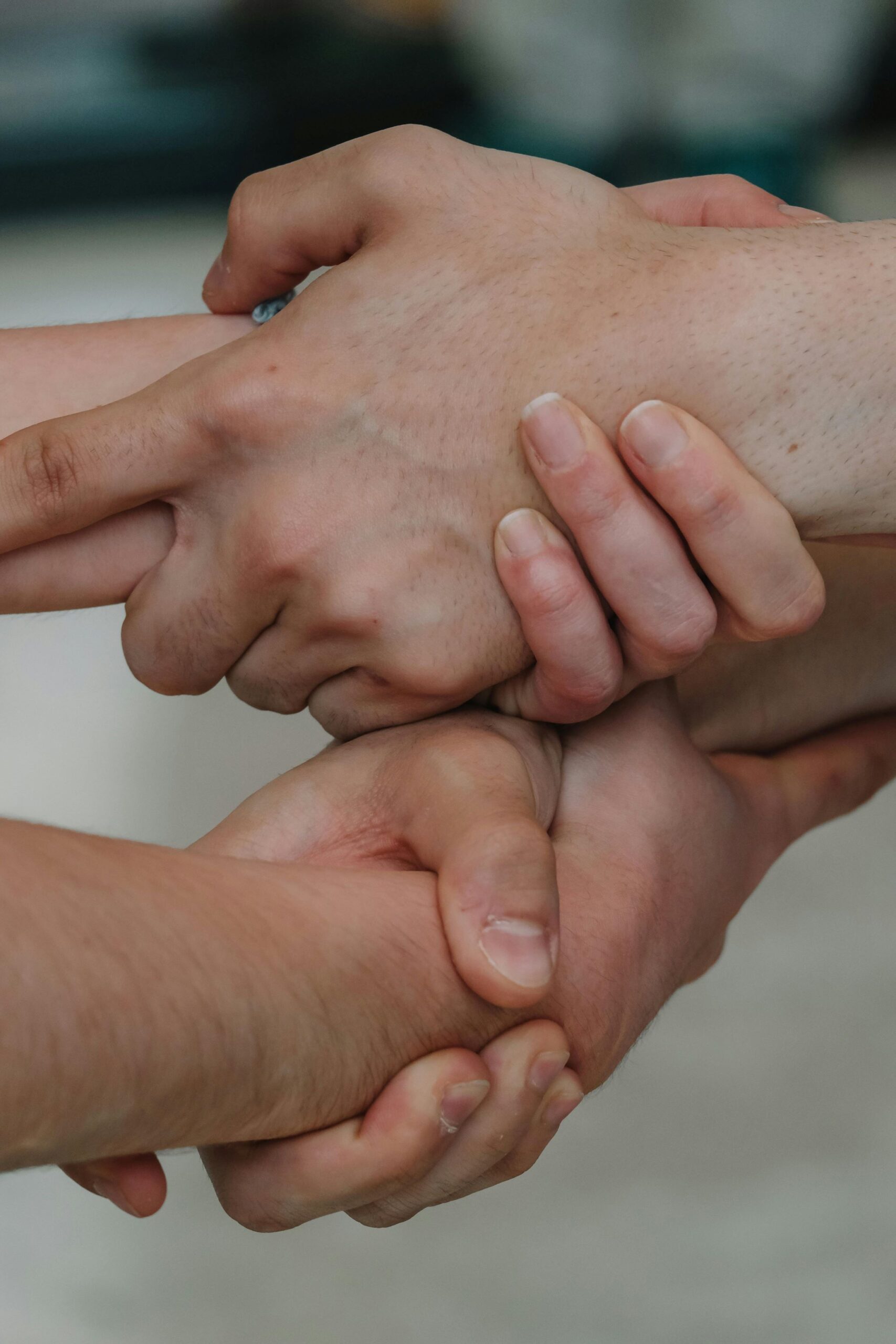 Hands held together in support